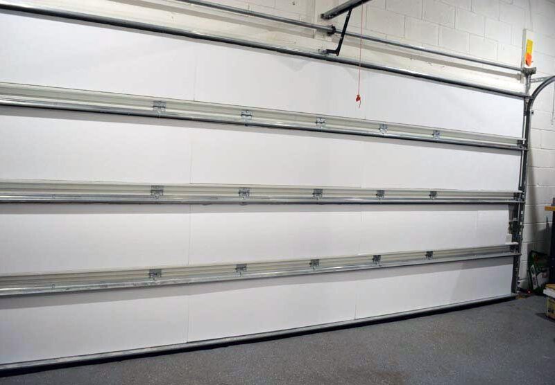 Insulated sectional garage door seen from inside the garage