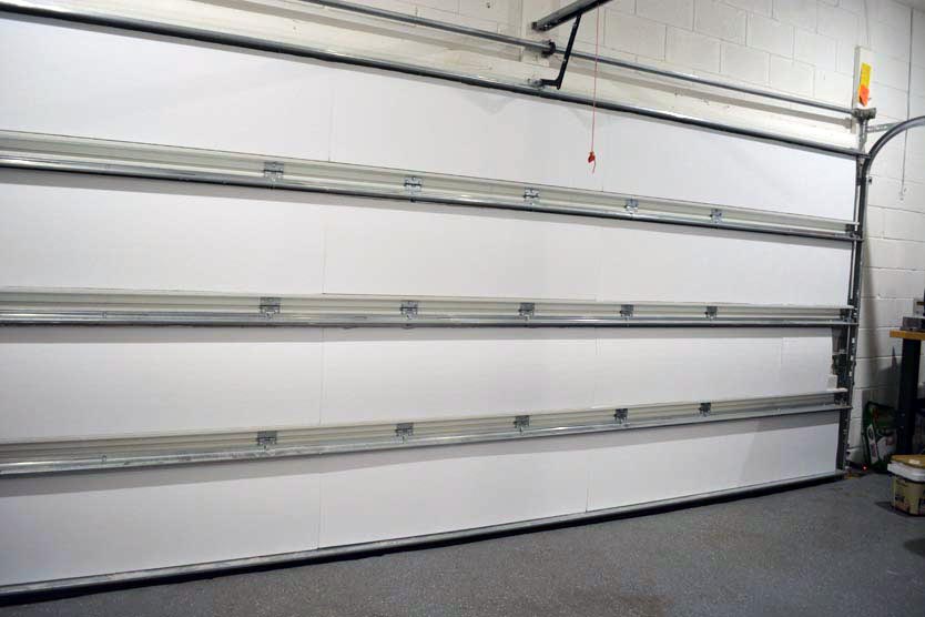 Insulated sectional garage door seen from inside the garage