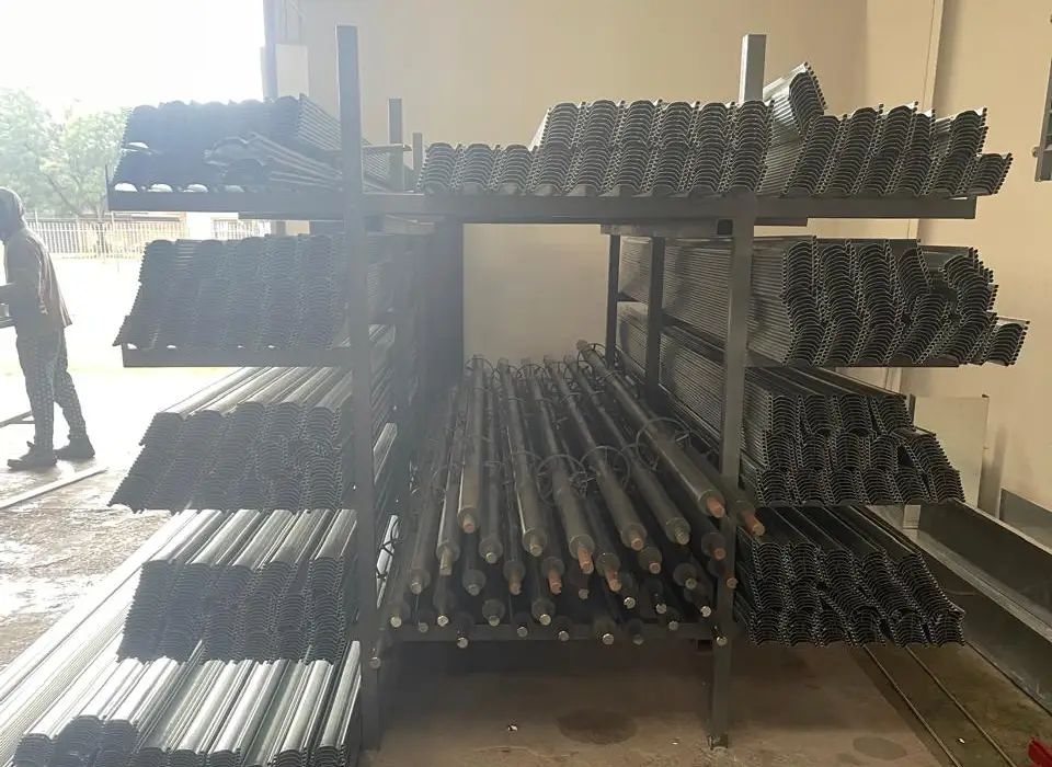 Racked roller shutter spares — slats, guide rails and rollers held in stock